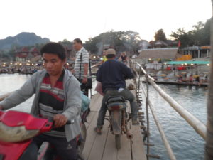 Motorbikes on a bamboo bridge, Vang Vieng, Laos, 2017
